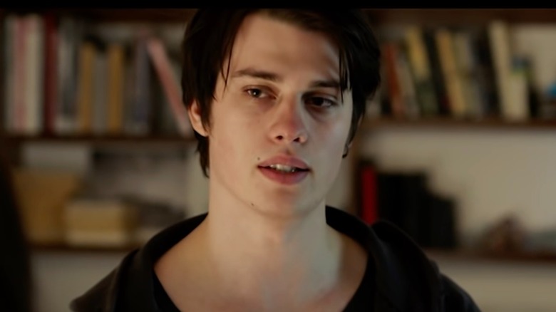 Close up of Nicholas Galitzine with black hair in black shirt in The Changeover