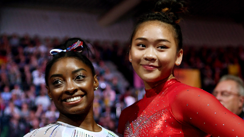 Team USA members Simone Biles and Sunisa Lee pose