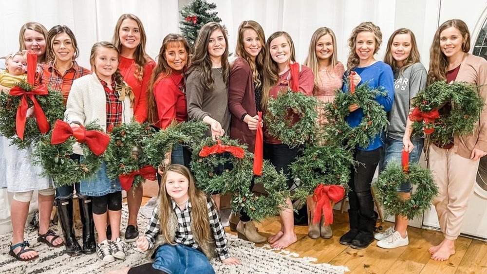 Duggar women holding wreaths