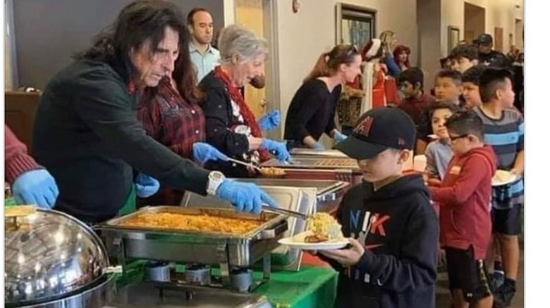 Alice Cooper working at food kitchen