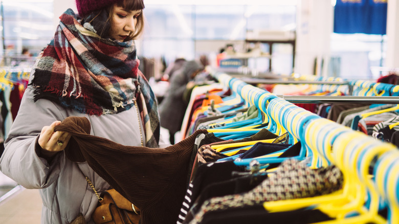 woman looking at clothes in a store