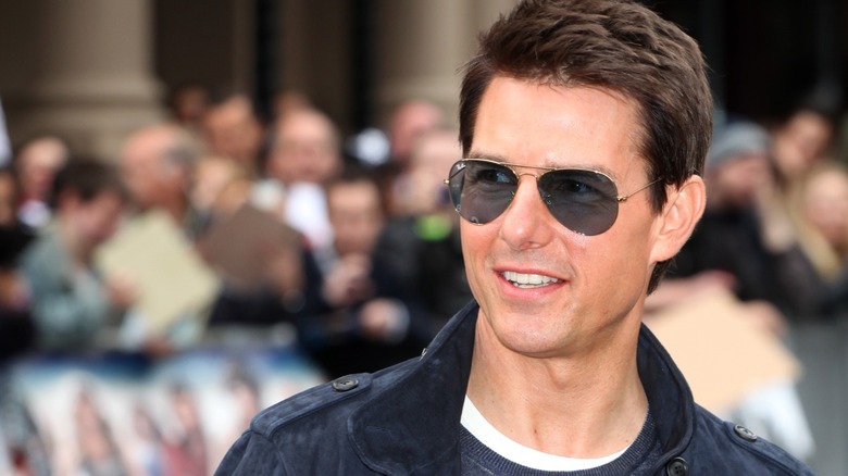 Tom Cruise smiling in sunglasses