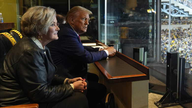 Susie Wiles sitting next to Donald Trump smiling