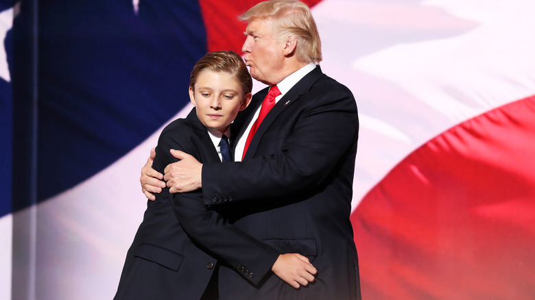 Donald Trump kissing Barron Trump's head