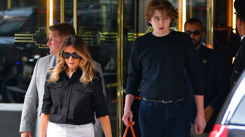 Barron Trump walking with his mother