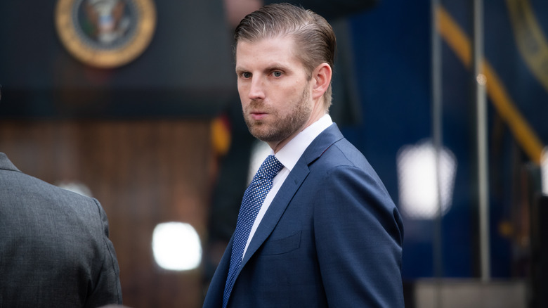 Eric Trump looking down