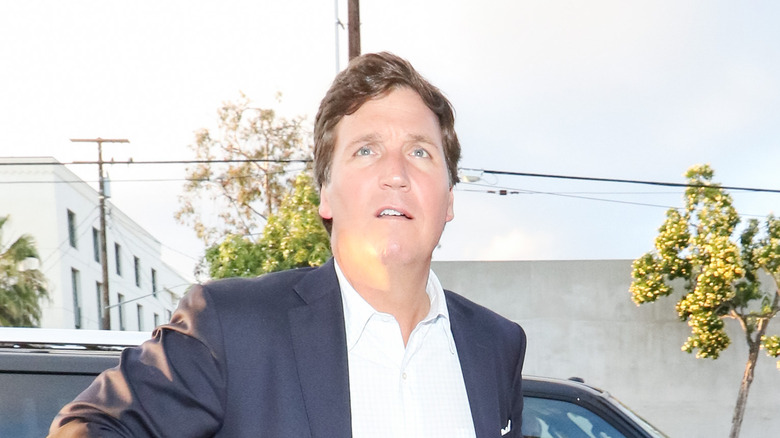 Tucker Carlson walking outside