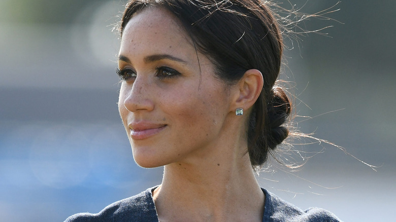 Meghan Markle posing outside