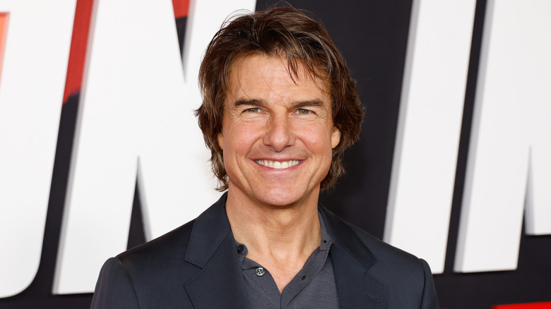 Tom Cruise with a big smile on the red carpet