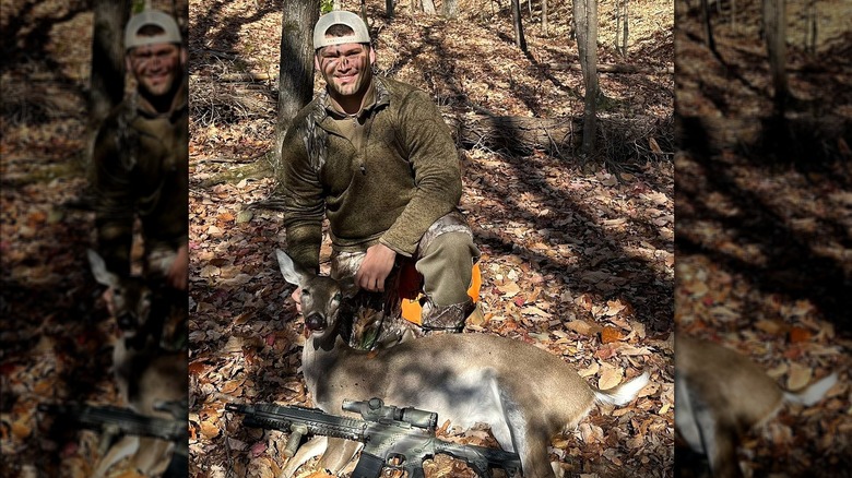 Derek Greene in camo with deer