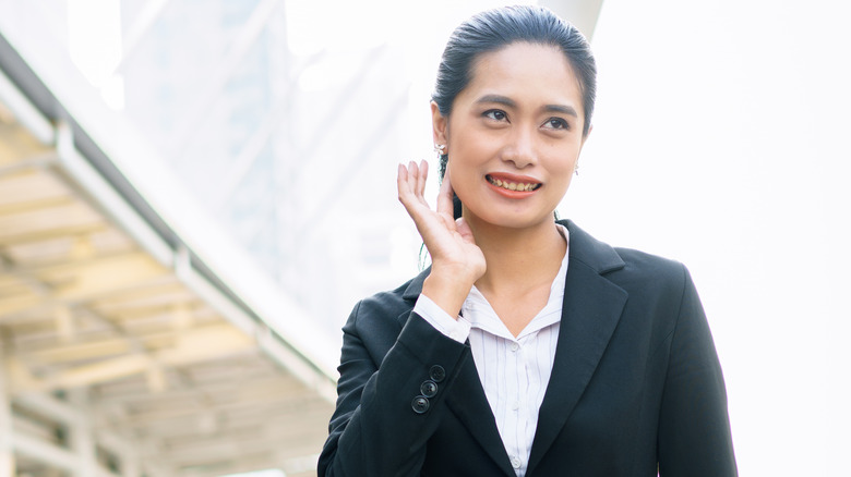 woman forcing a smile