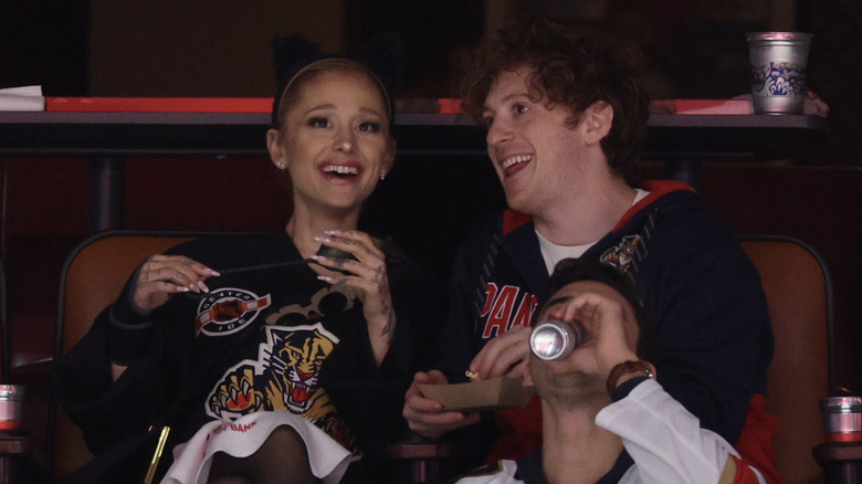 Ariana Grande and Ethan Slater smiling