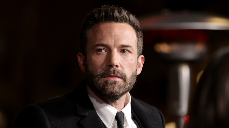 Ben Affleck looking pensive in a suit and tie