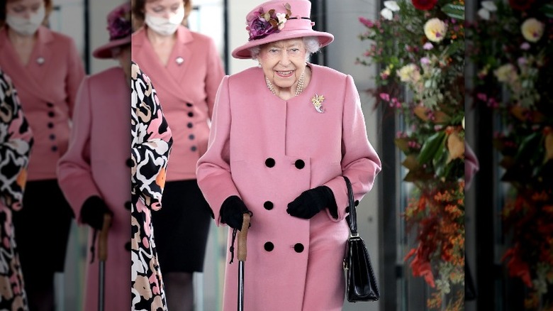 Queen Elizabeth using a cane