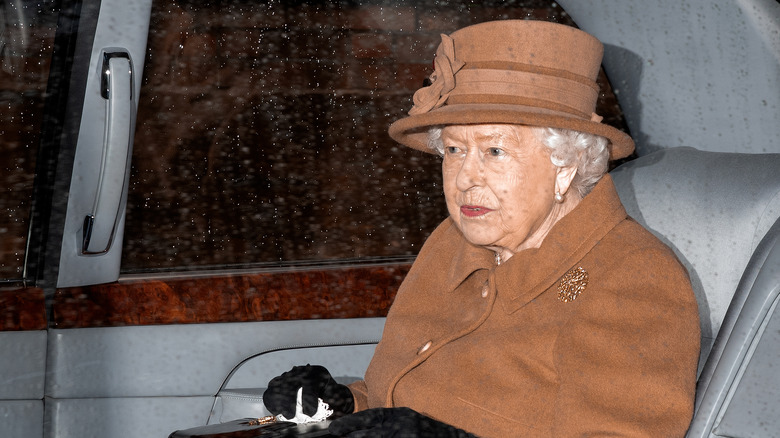 Queen Elizabeth sitting in car