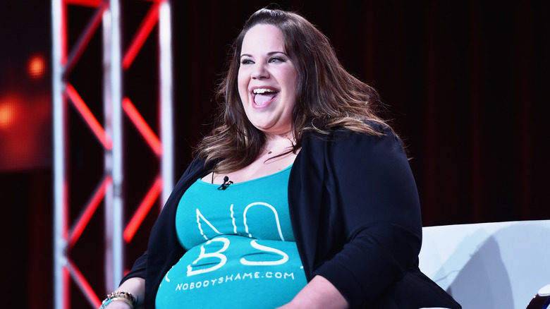 Whitney Way Thore on stage with wide smile