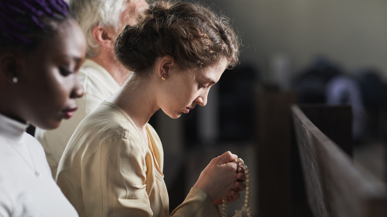 Young woman with rosary 