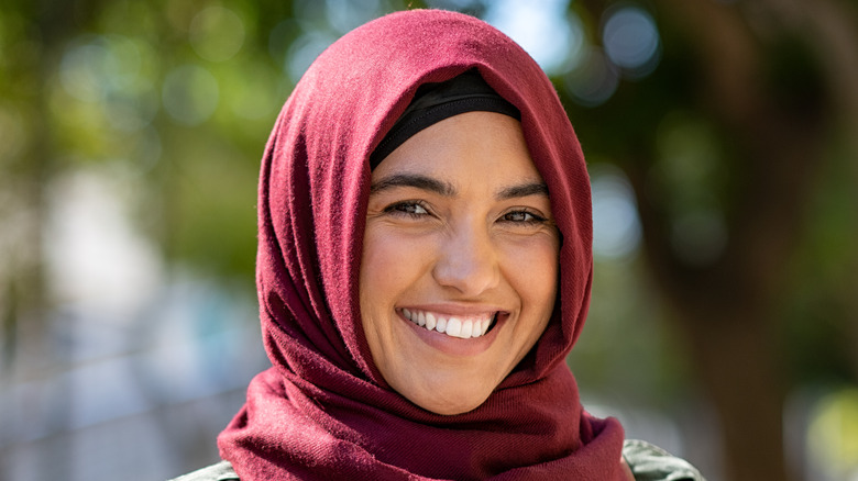 A young Muslim woman smiling 