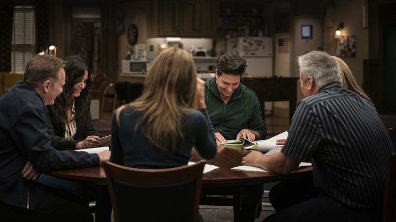 Friends cast sat around table