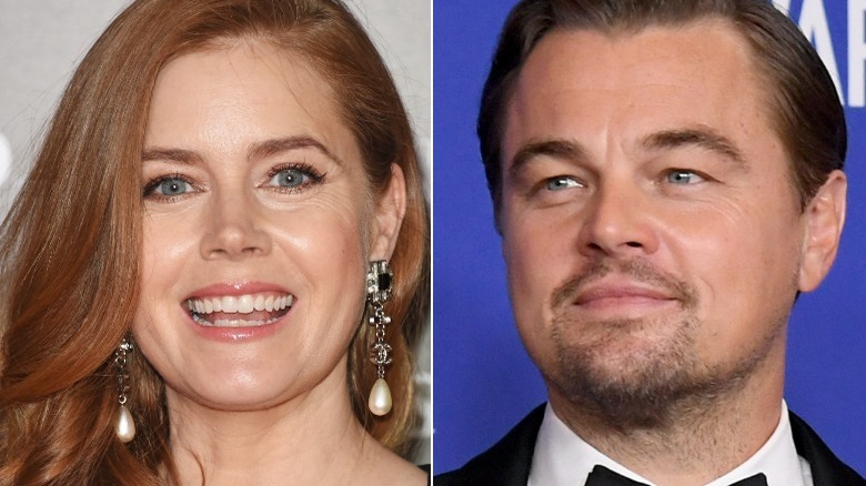 Amy Adams laughing; Leonardo DiCaprio smiling