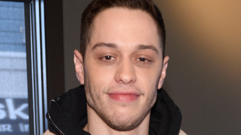 Pete Davidson gives a thumbs up at an event