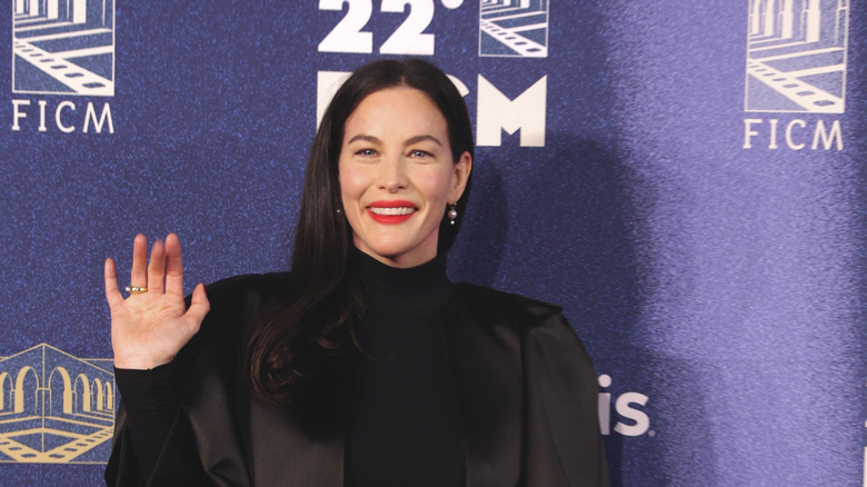 Liv Tyler smiling and waving