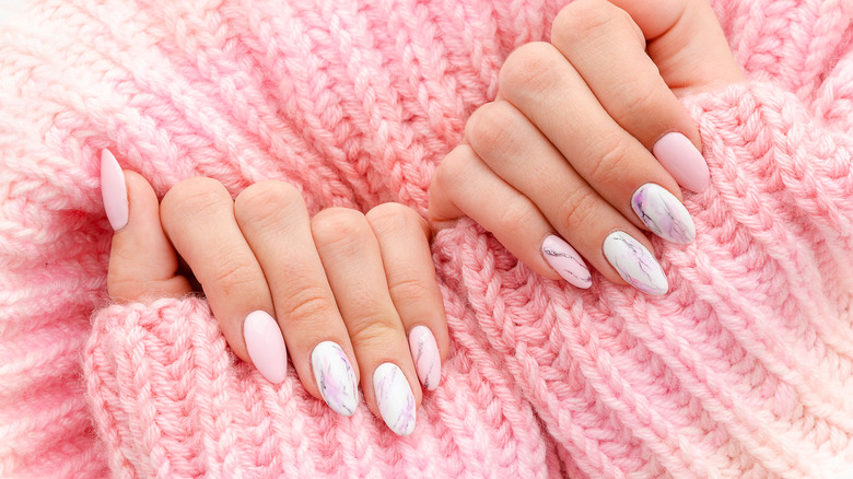 A pair of hands with manicured nails