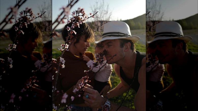 Nikki Reed, Ian Somerhalder, and their child outside