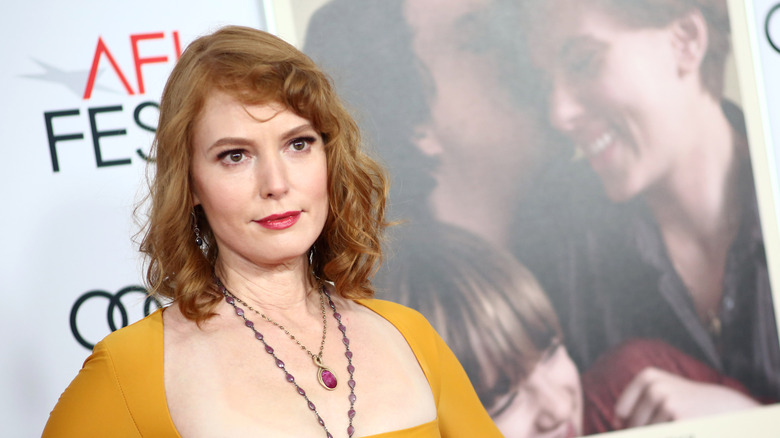 Alicia Witt in a yellow dress