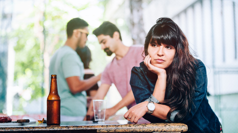 Woman alone at party