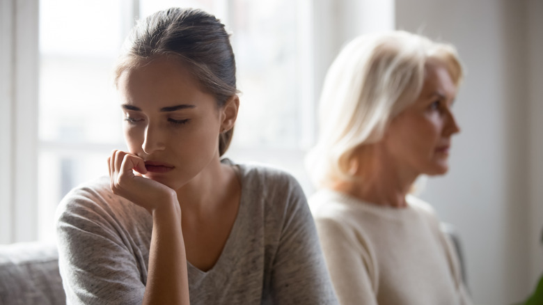 Younger woman beside older woman