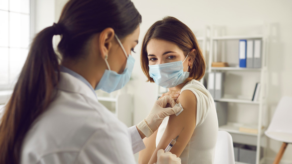 Person receiving COVID vaccine