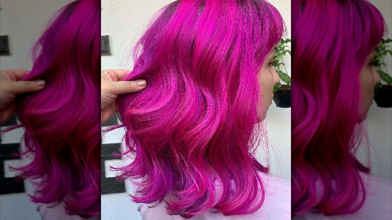 Woman with bright pink hair