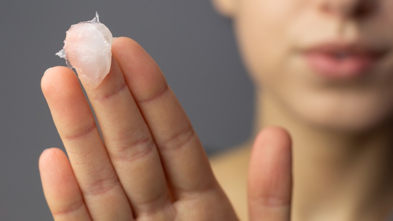 Woman with a scoop of Vaseline 