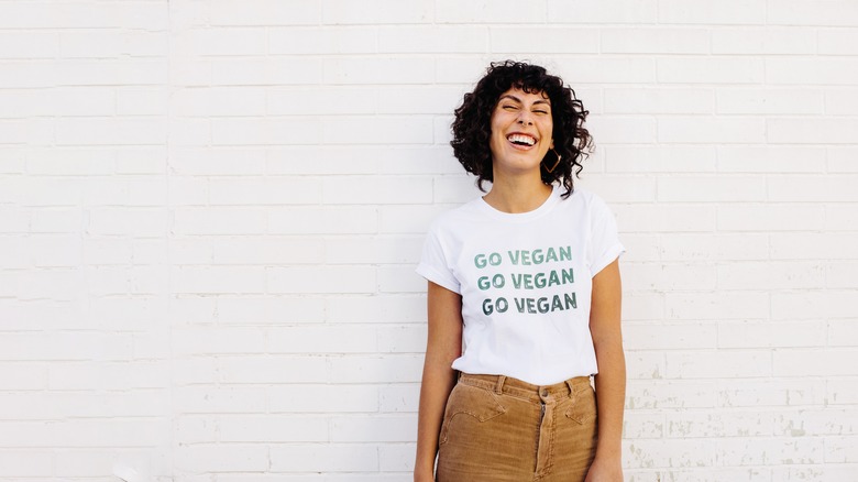 Laughing woman in vegan shirt