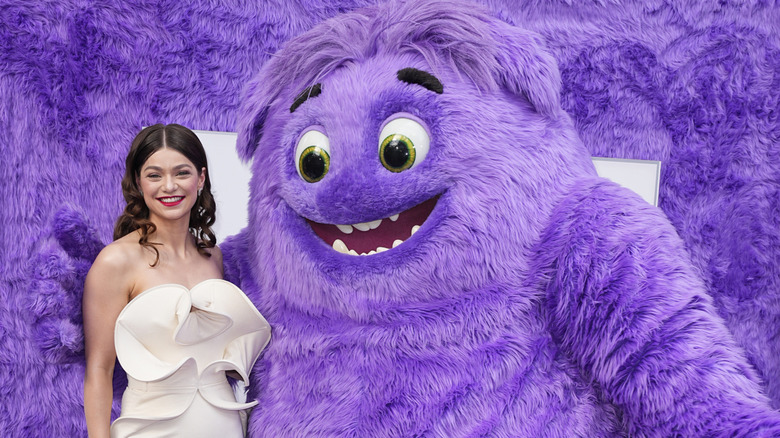 Catharine Daddario and large purple creature at the premiere of IF