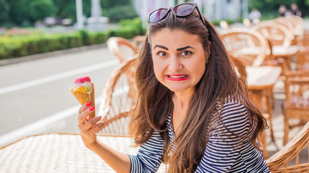 Woman looking dubious about ice cream