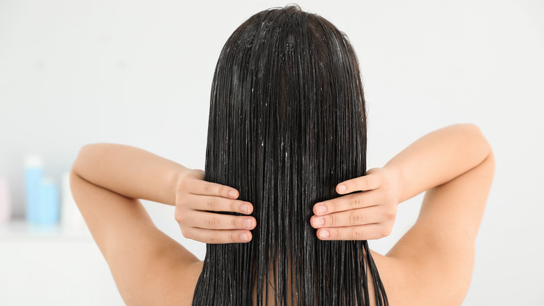 Girl Applying Leave-In Conditioner