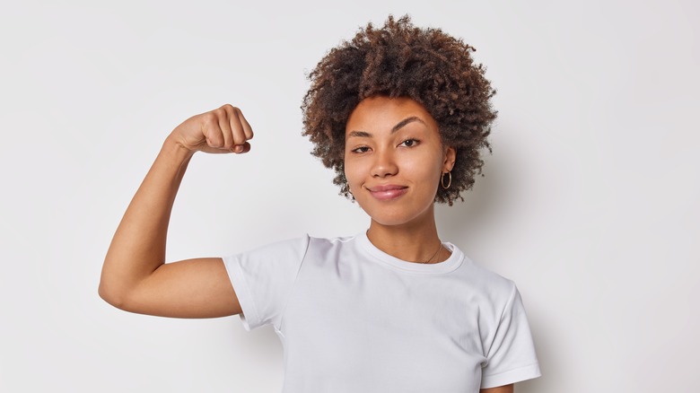 Woman flexing bicep