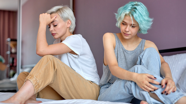 tense couple on bed