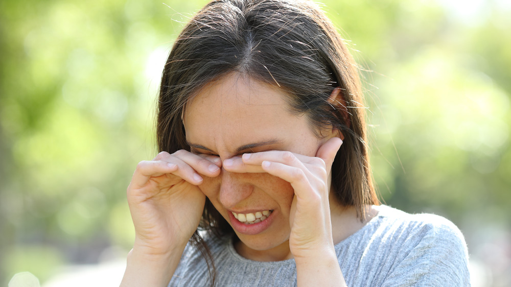 A woman with irritated eyes