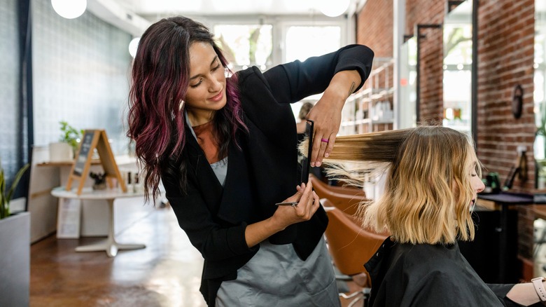 Woman getting haircut