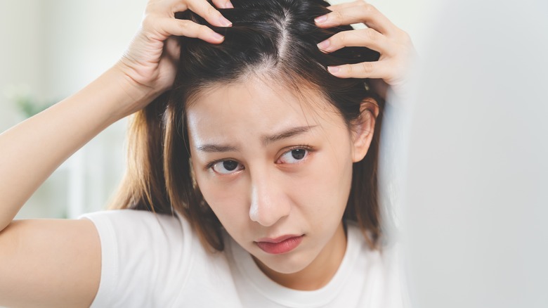 woman concerned about dandruff