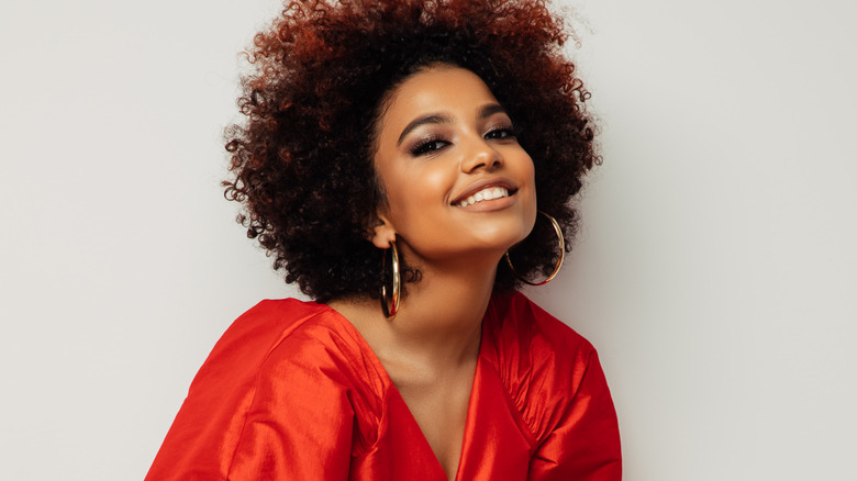 Woman with an afro in a red dress