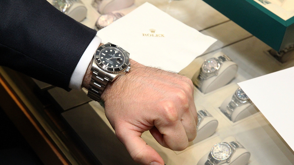 A man wearing a Rolex watch