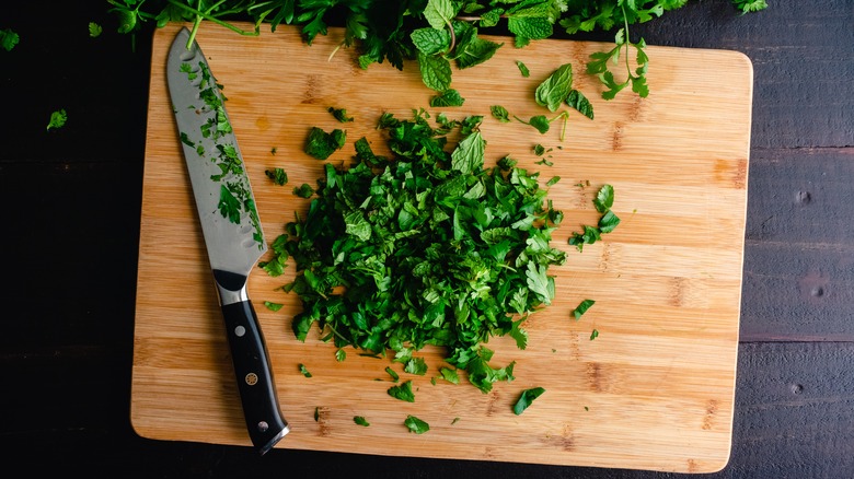 Chopped herbs on cutting board