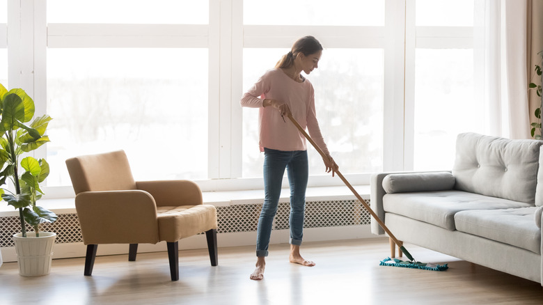 Woman cleaning wood floors