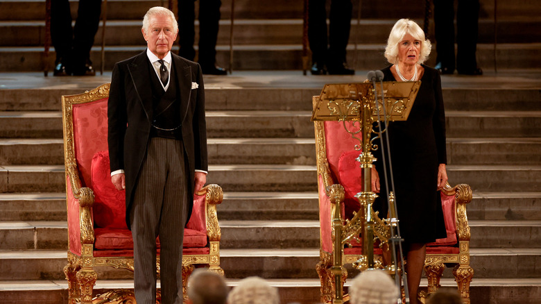 King Charles and Queen Camilla stand for anthem