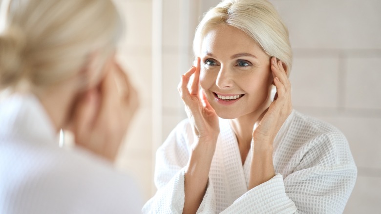 woman smiling in the mirror