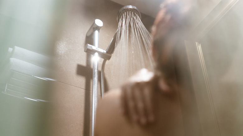 woman taking hot shower